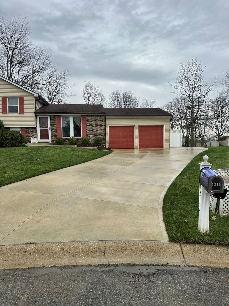 Curved concrete driveway on a cul de sac washed clean