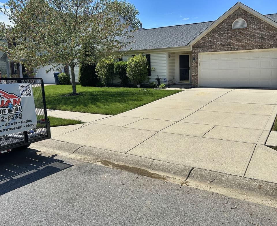 After: driveway in front of a brick ranch, washed clean