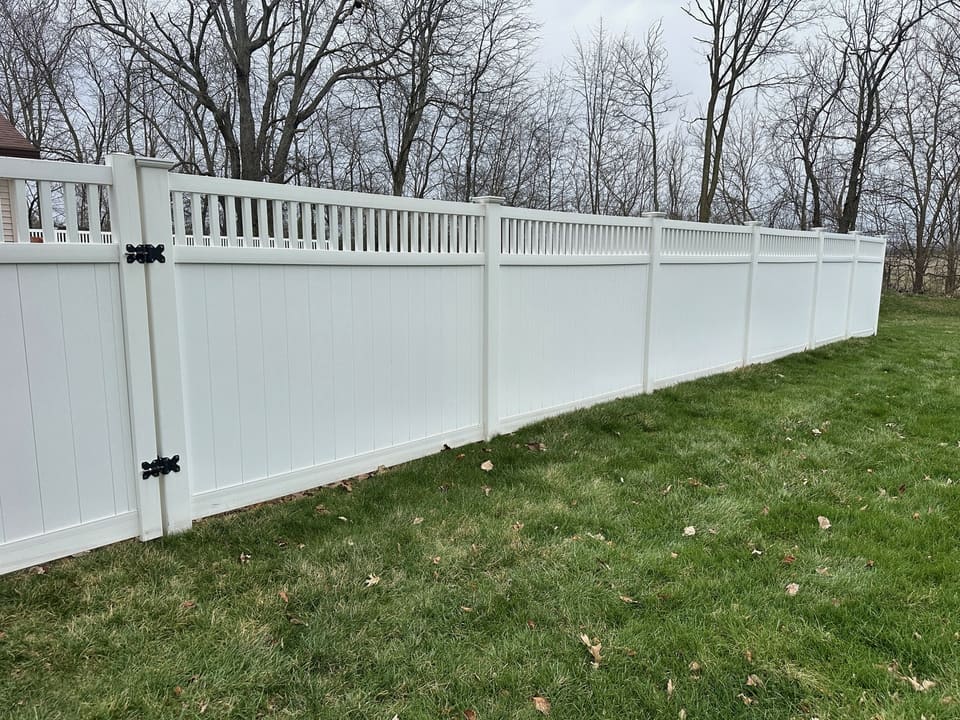 Long white vinyl privacy fence after washing