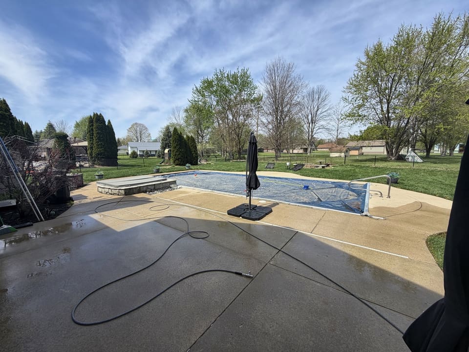 Wide view of a pool deck after pressure washing