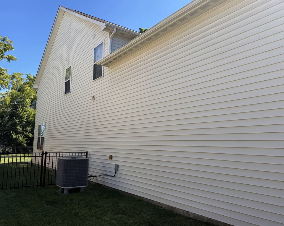 After: two story cream vinyl side wall, washed clean
