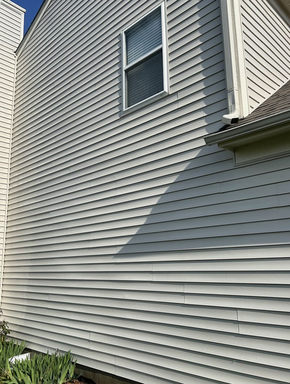 After: inside corner of a vinyl home, washed clean