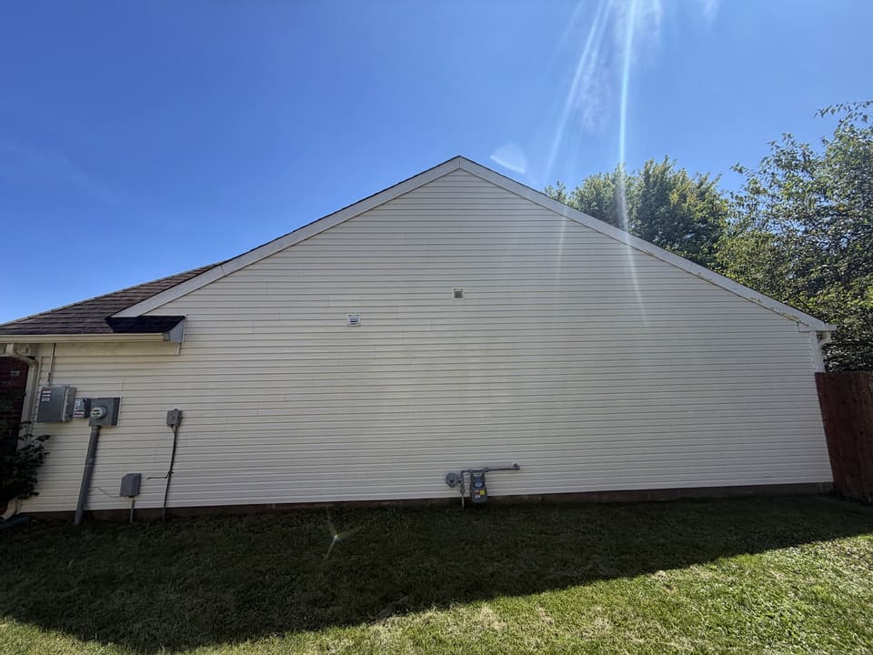 After: white vinyl gable wall, washed clean
