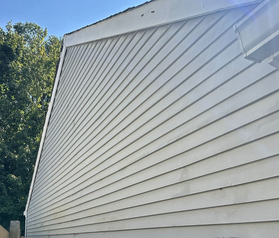 After: vinyl side wall near the electric meter, washed clean