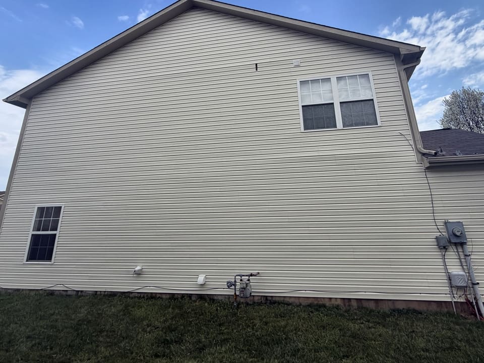 After: two story vinyl gable wall, washed clean