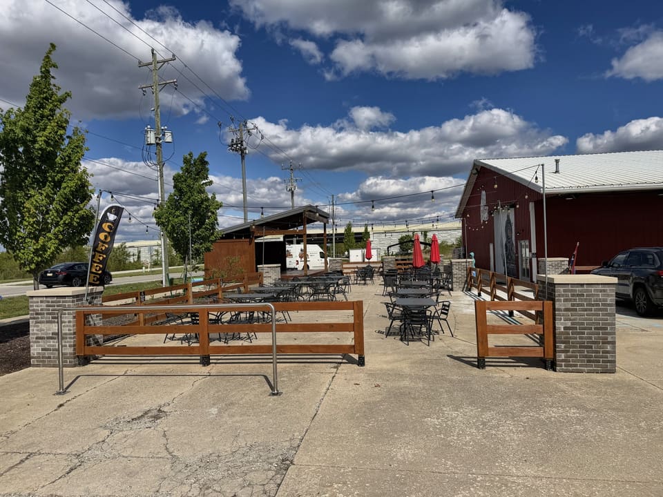 Outdoor patio and brick pillars at a red barn venue after pressure washing